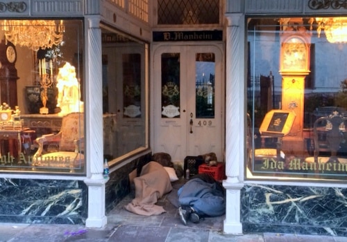 People sleeping in the doorway of a Royal Street business this past weekend. (photo by Danae Columbus for UptownMessenger.com)