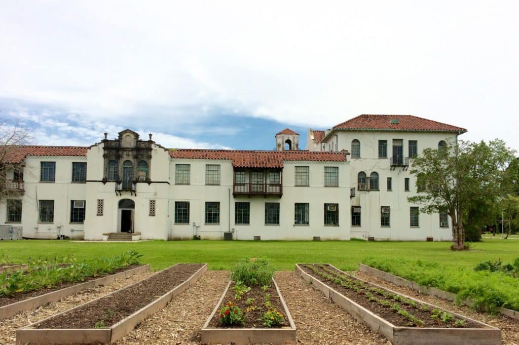 Two Acre Farms Vegetable and Herb plots at Hope Haven Center’s. The 1930s historic buildings were formerly an orphanage. (Froeba)