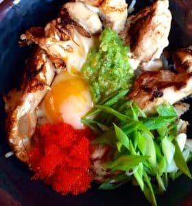 Oyakudon Rice Bowl, Japanese Chicken and Fried Egg Rice, with a Spicy Green Chili Paste, Salmon Caviar, Green Onions over Jasmin Rice. (Kristine Froeba)
