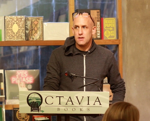 Author Ethan Brown answers questions after reading from his new book, "Murder in the Bayou," on Wednesday evening at Octavia Books. (Robert Morris, UptownMessenger.com)
